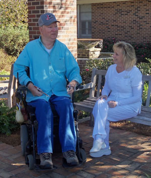 nurse and patient talking outside