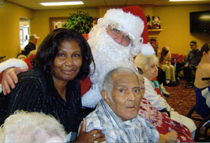 patients with santa smiling at the camera